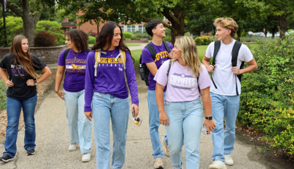 a group of people standing next to a tree